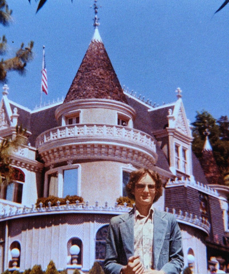 Ace Miles around age sixteen, arms crossed, standing in front of the Magic Castle's turret in Hollywood, 1978.